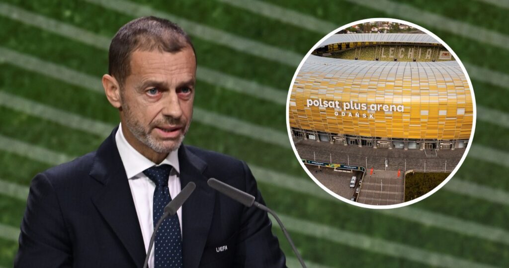 Stadion piłkarski nocą z oświetleniem i trybunami pełnymi kibiców